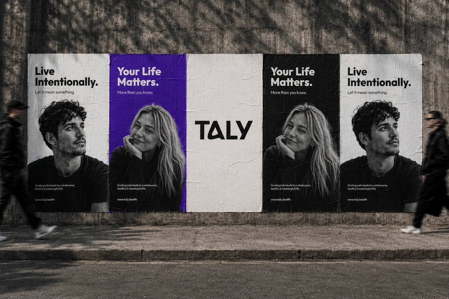 Taly poster wall: Live Intentionally and Your Life Matters portraits pasted on a concrete wall